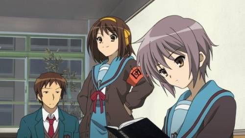 Kyon sitting in class room, Haruhi Suzumiya smiling, Yuki Nagato reading book, The Disappearance of Haruhi Suzumiya