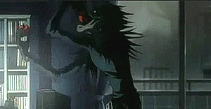 Ryuk stuffing his face with apples as Light asks Ryuk why he chose him